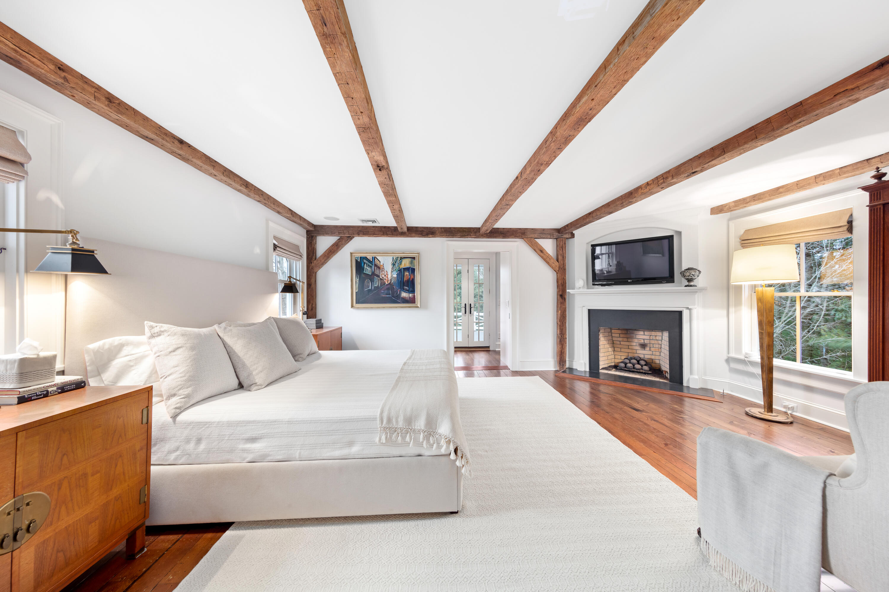 5 Middlesex Road Darien, CT 06820 - Photo 34 of 57 a living room with furniture a fireplace and a floor to ceiling window