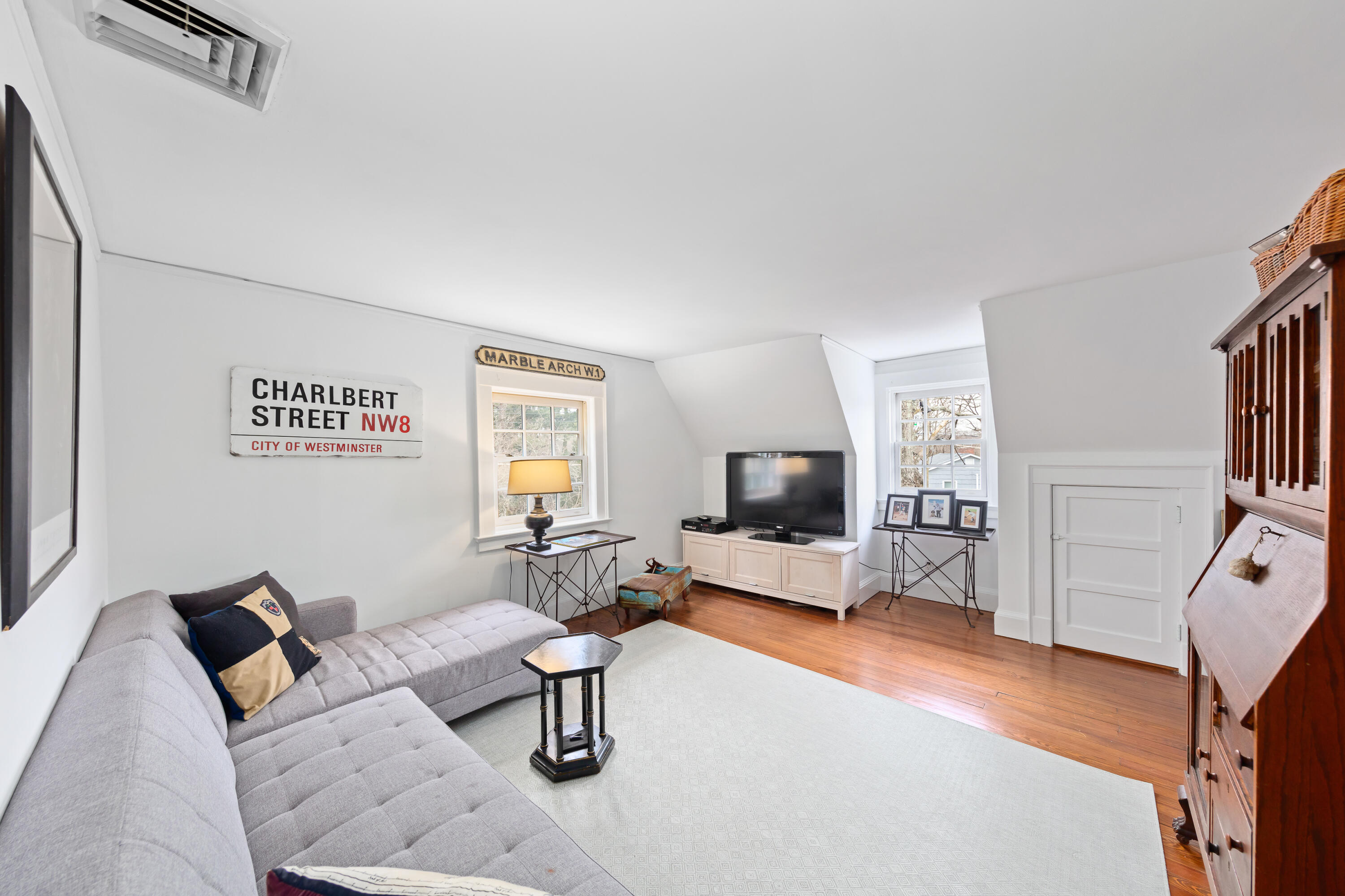 5 Middlesex Road Darien, CT 06820 - Photo 50 of 57 a living room with furniture and a flat screen tv
