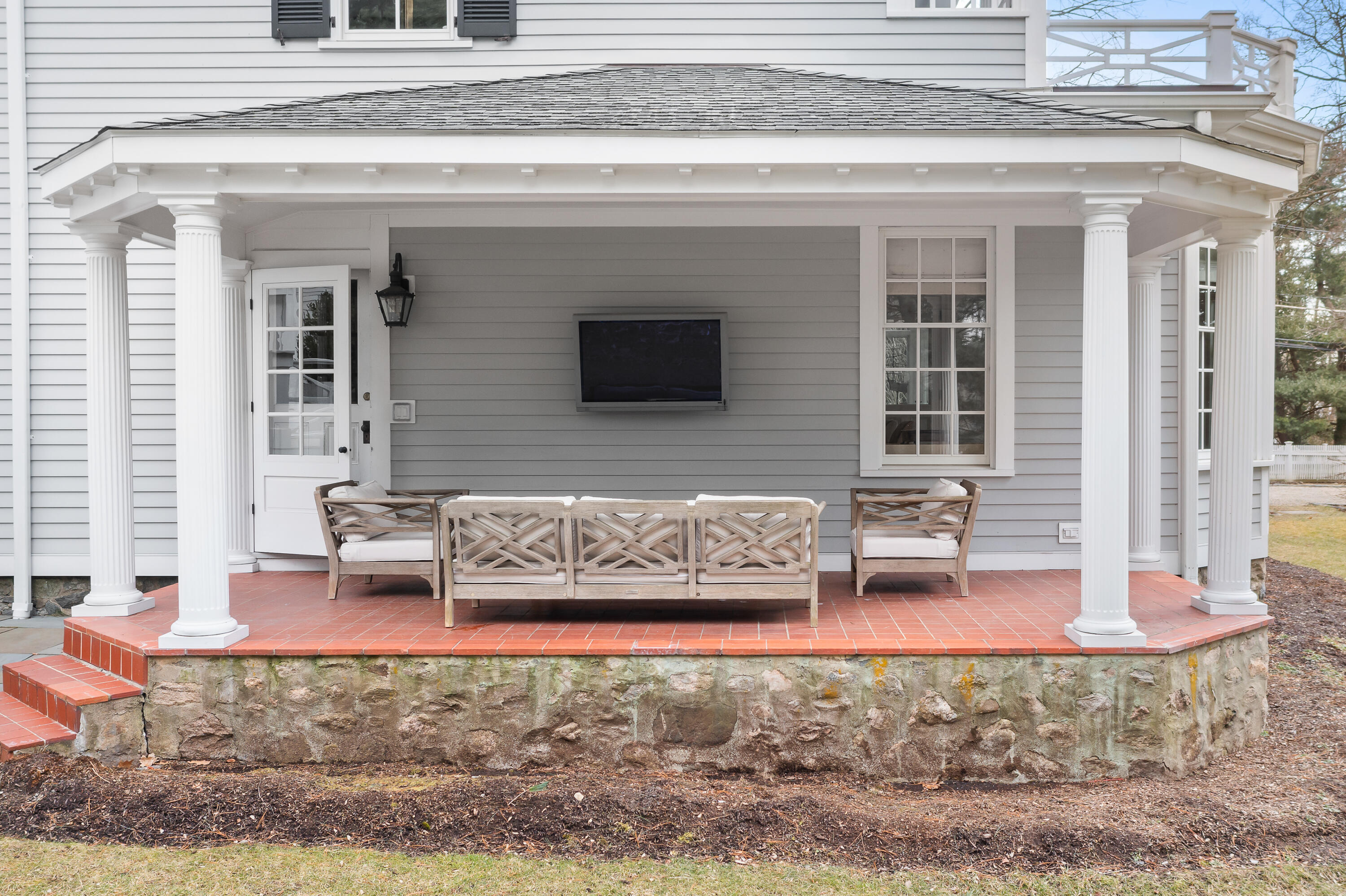 5 Middlesex Road Darien, CT 06820 - Photo 57 of 57 a view of front door of house with outdoor seating