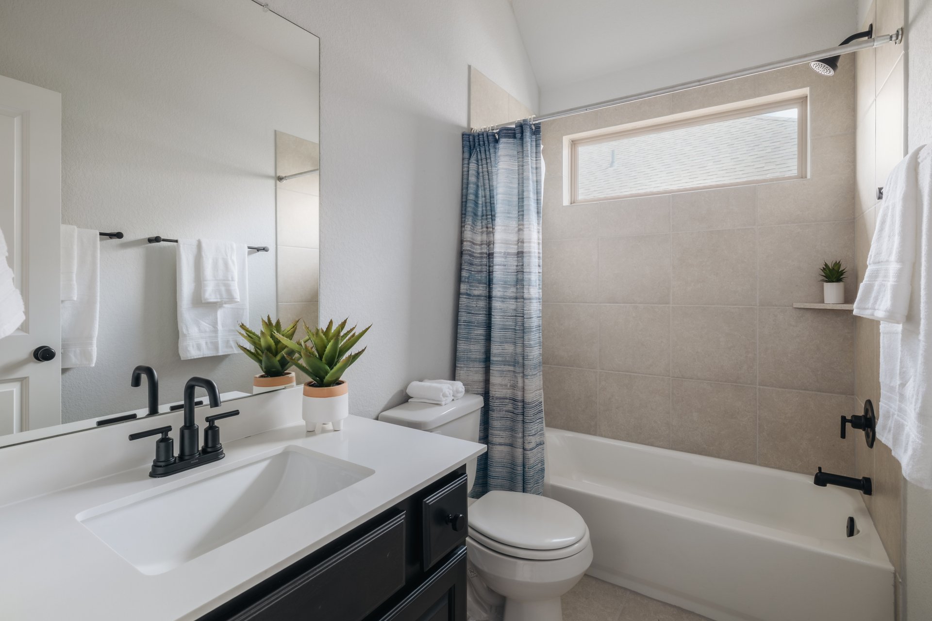 317 Autumn Oak Way Georgetown, TX 78628 - Photo 33 of 40 a bathroom with a sink a toilet a tub and shower