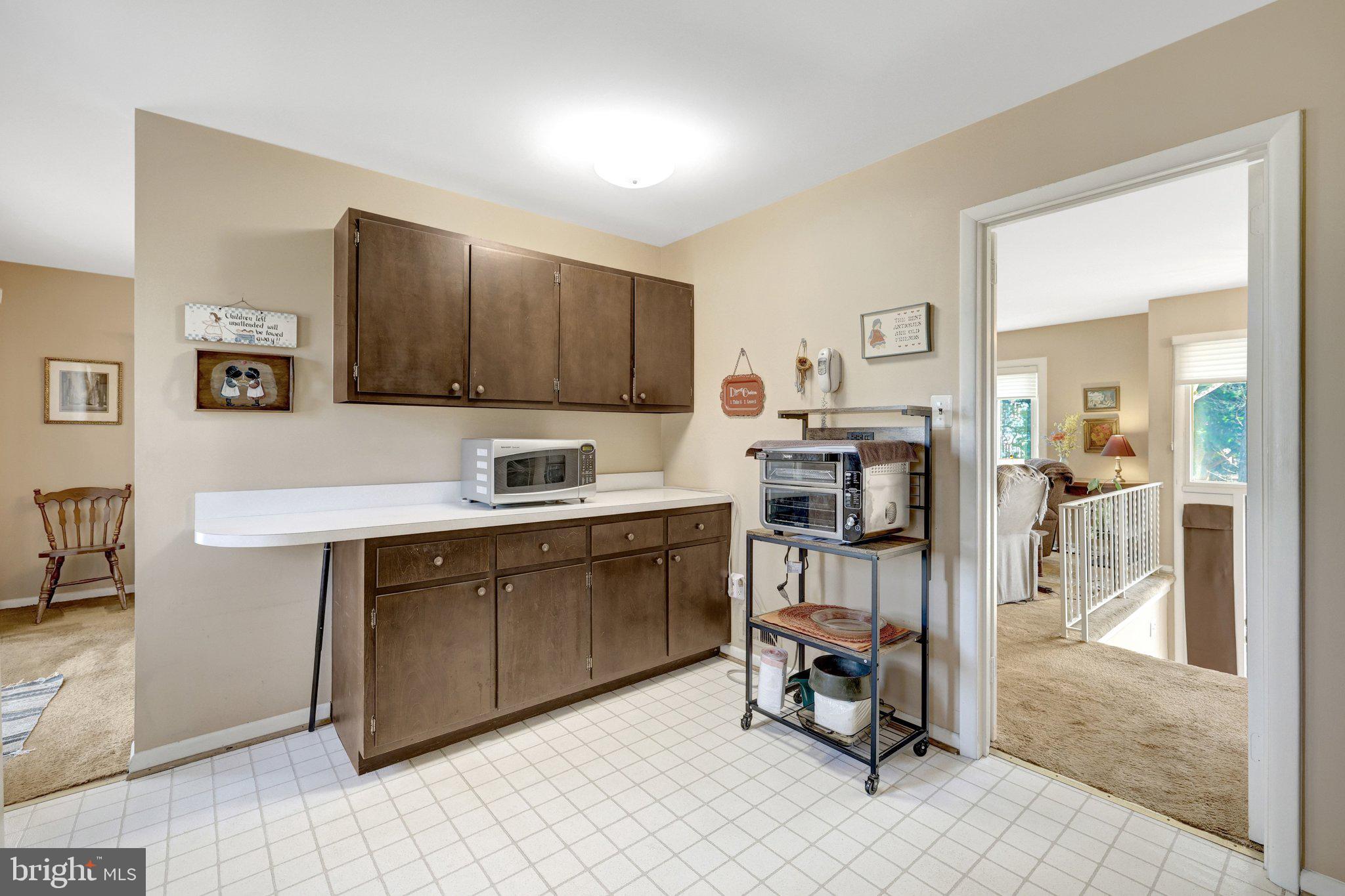 203 Locust Street Southwest Vienna, VA 22180 - Photo 14 of 54 a kitchen with a sink cabinets and window