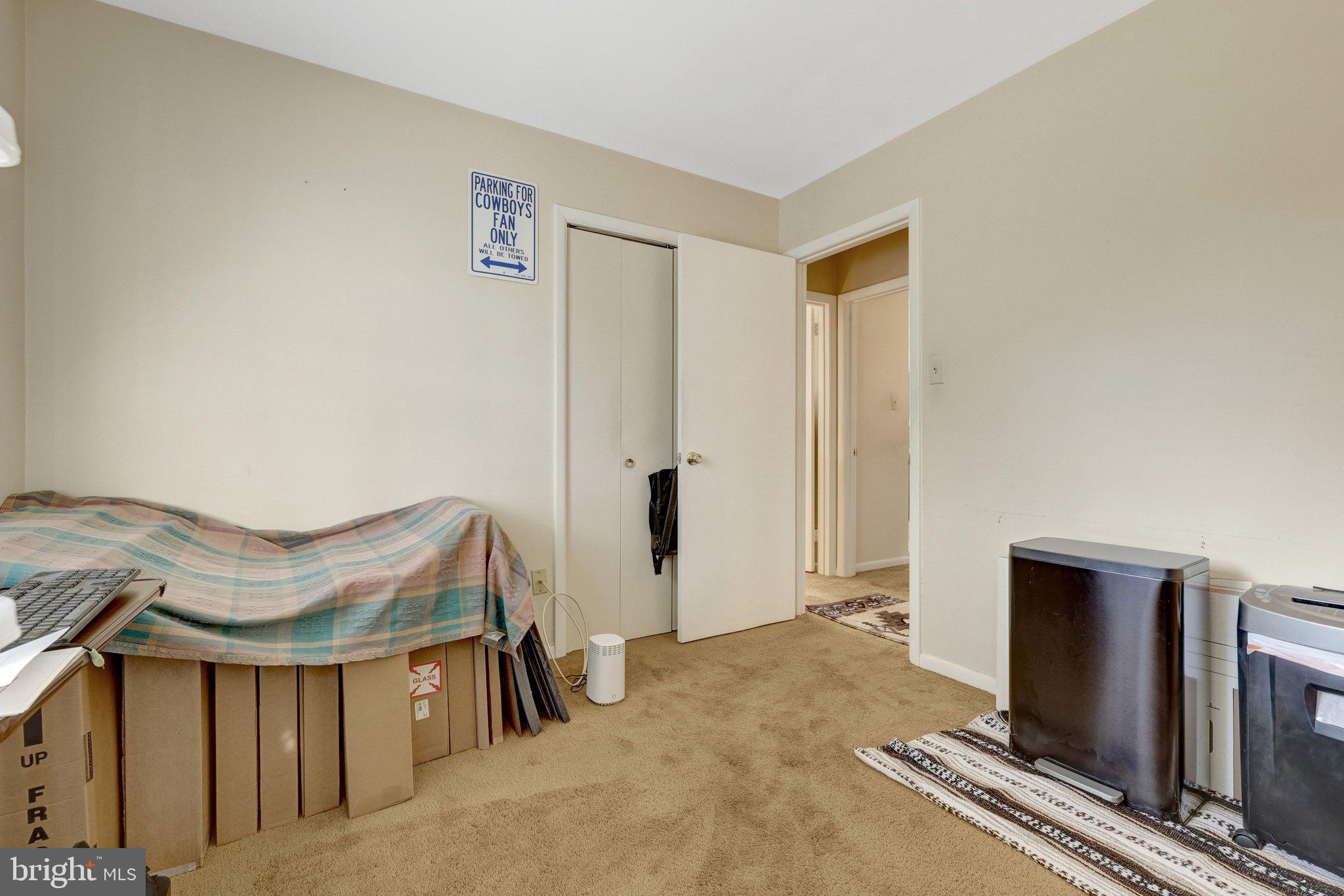 203 Locust Street Southwest Vienna, VA 22180 - Photo 19 of 54 a bedroom with a bed and a flat screen tv