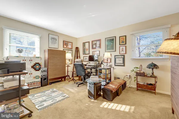 a living room with furniture window and a flat screen tv