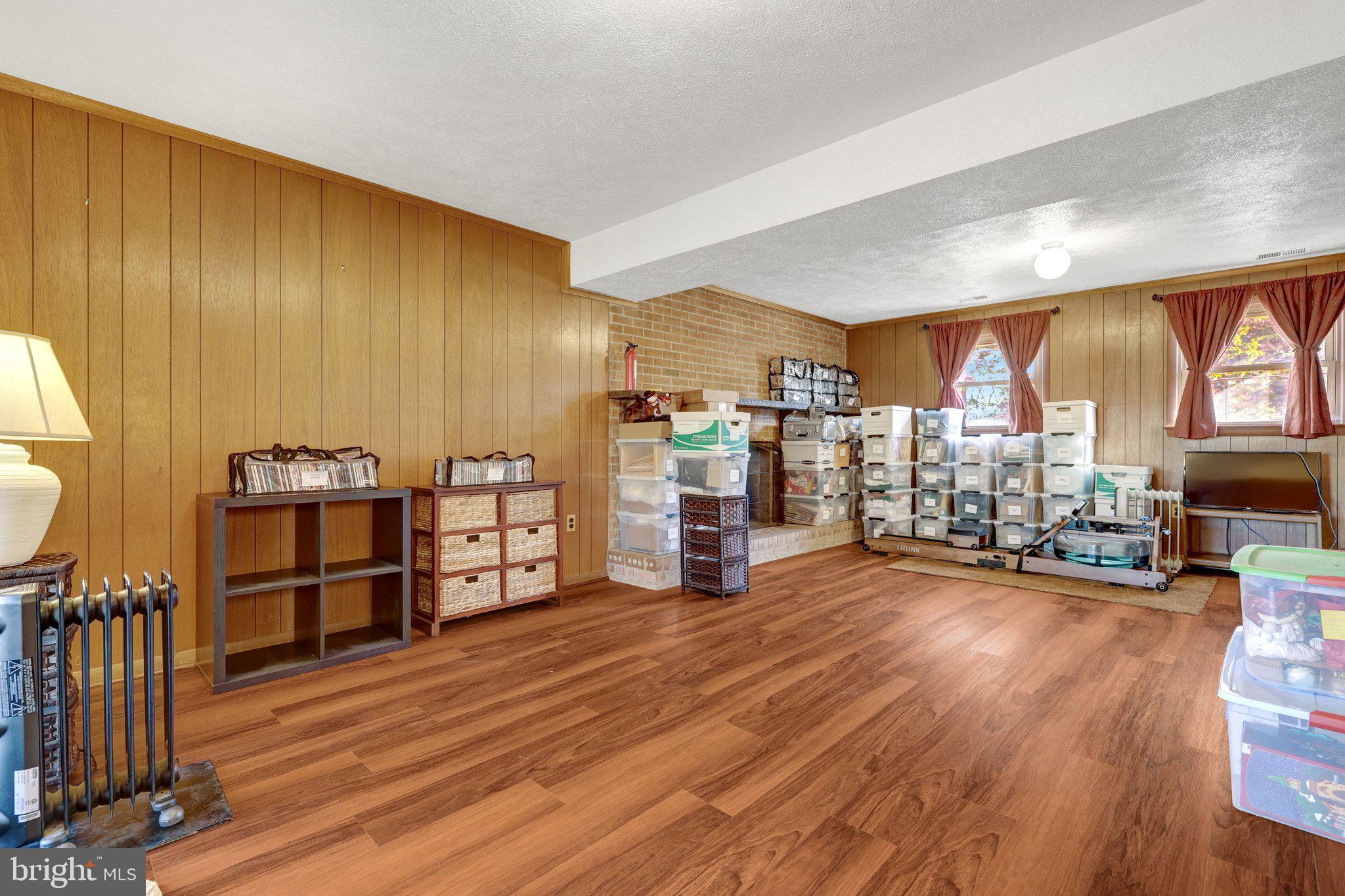 203 Locust Street Southwest Vienna, VA 22180 - Photo 31 of 54 a view of a living room with furniture and wooden floor