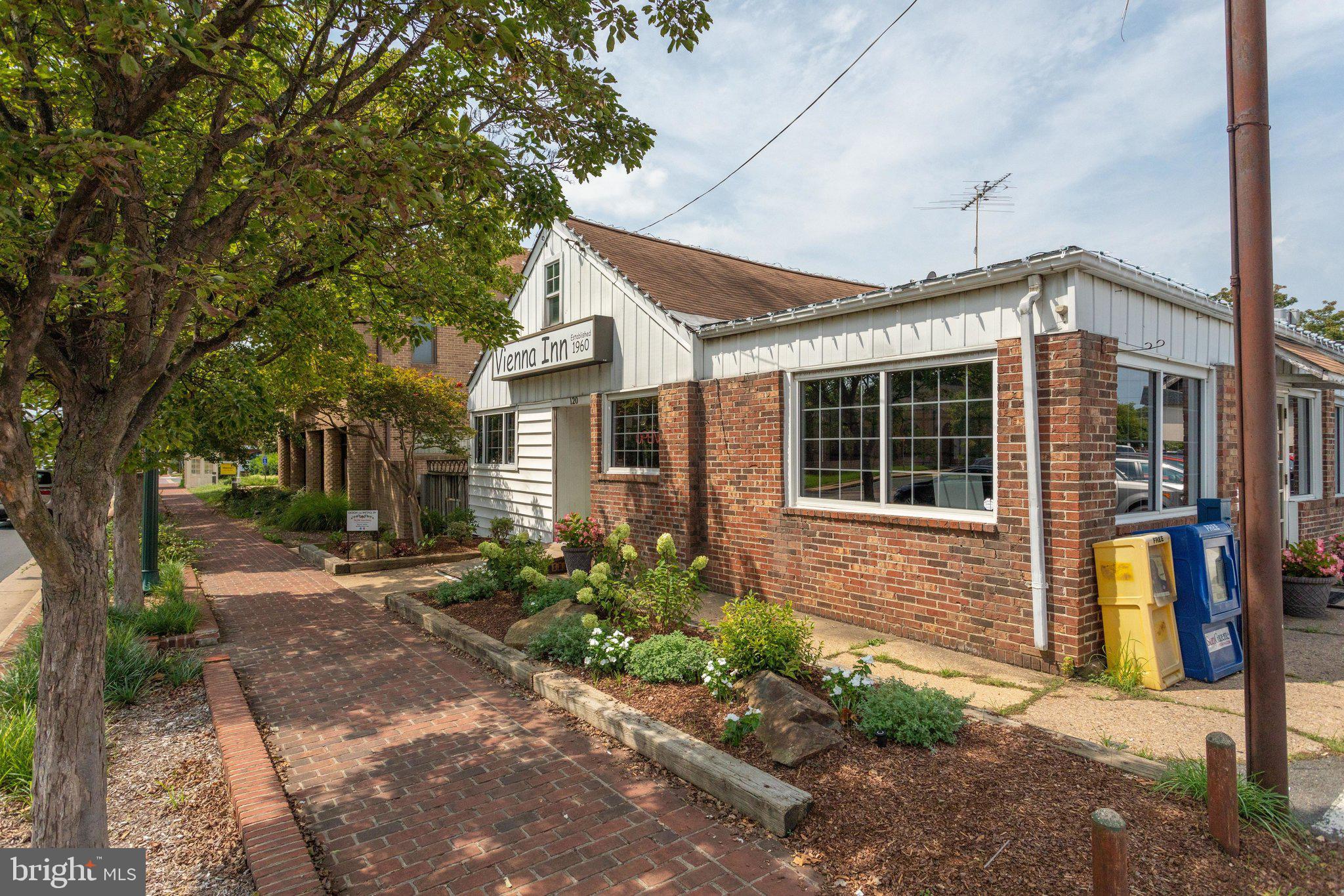 203 Locust Street Southwest Vienna, VA 22180 - Photo 49 of 54 a front view of a house with garden