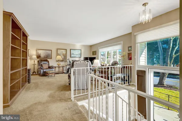 a view of living room with furniture and floor to ceiling window