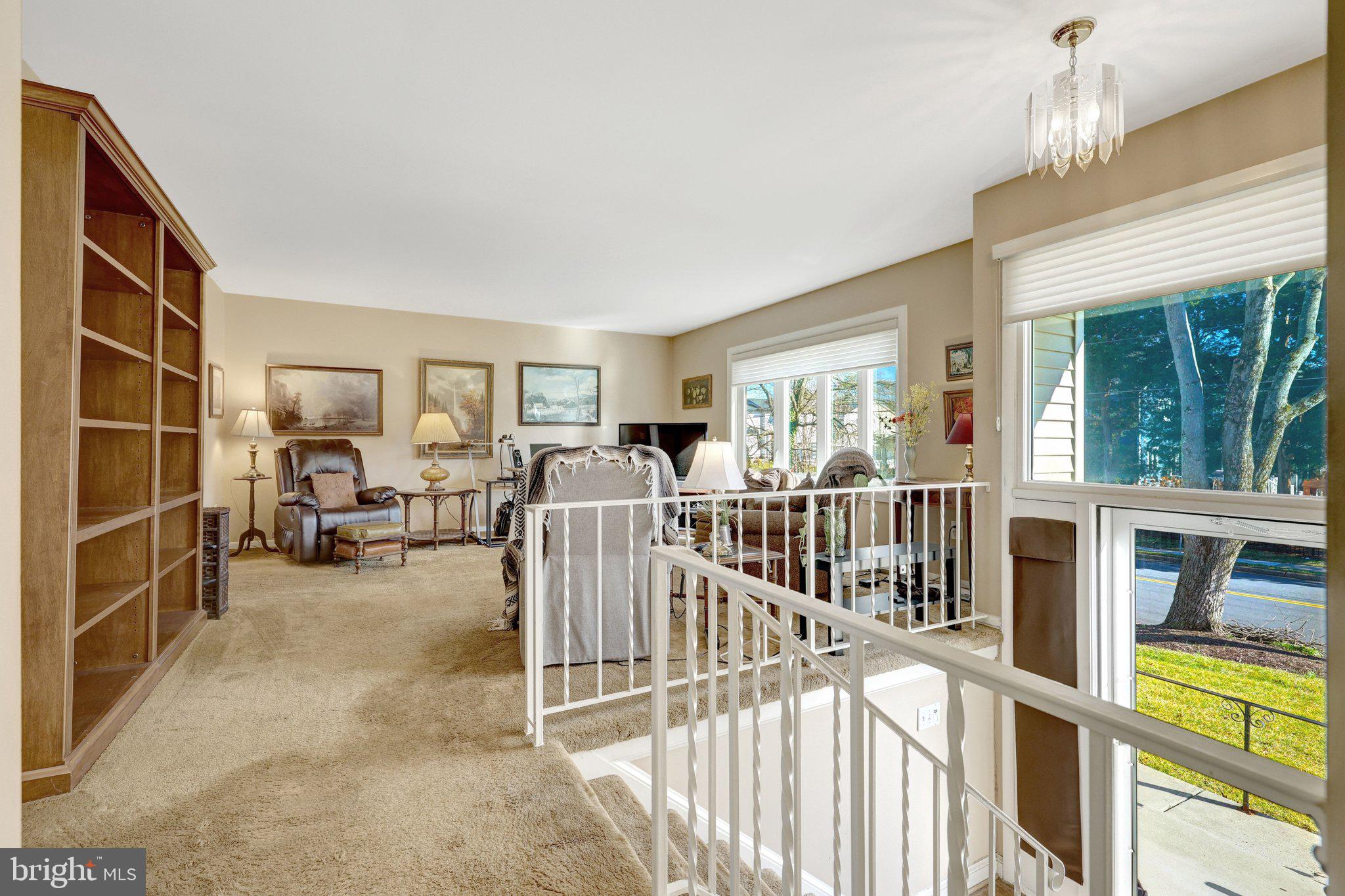 203 Locust Street Southwest Vienna, VA 22180 - Photo 6 of 54 a view of living room with furniture and floor to ceiling window