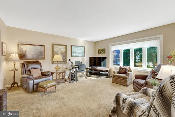 a living room with furniture or couch and a flat screen tv