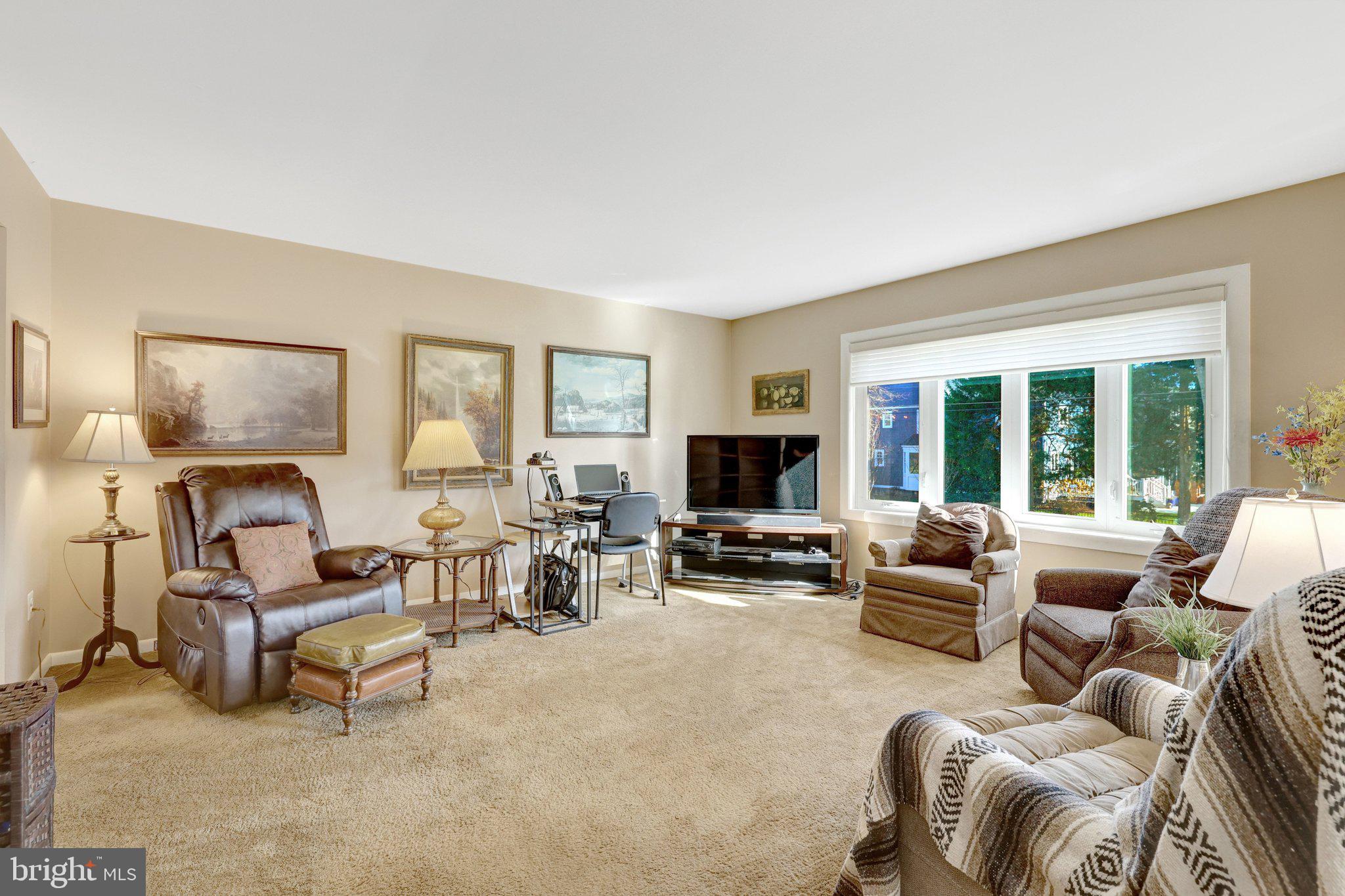 203 Locust Street Southwest Vienna, VA 22180 - Photo 7 of 54 a living room with furniture or couch and a flat screen tv