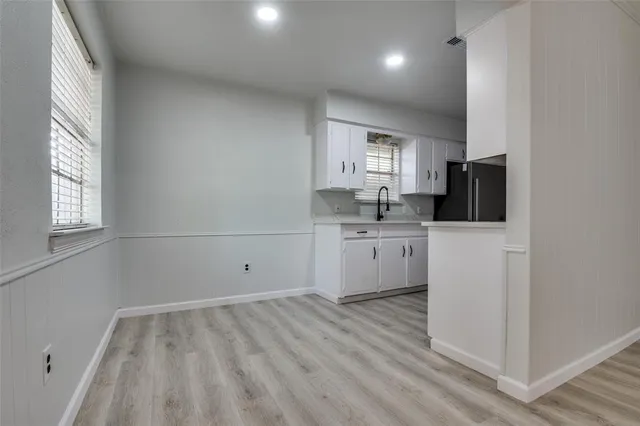 a view of a kitchen with a sink cabinets and a window