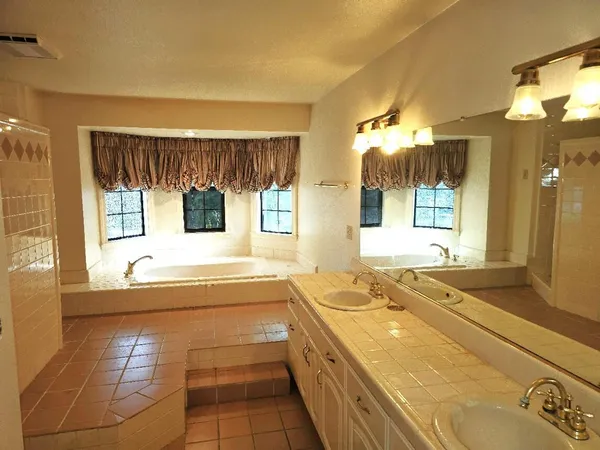 a view of a kitchen with a sink and microwave