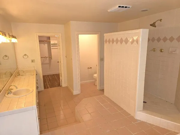 a large kitchen with a lot of counter space and a sink