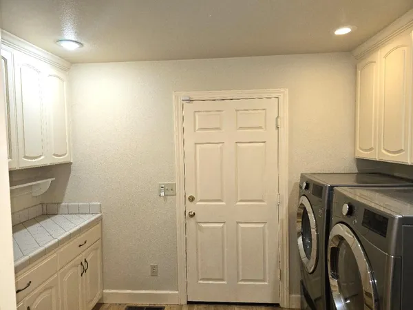 a bathroom with a sink toilet and vanity