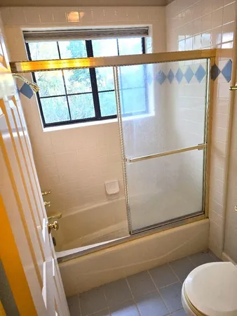 a view of closet with wooden floor
