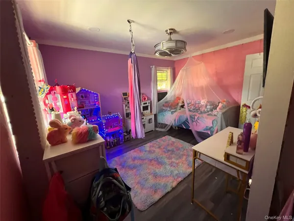 a bedroom with furniture and a window