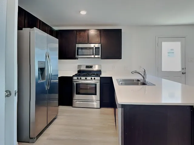 an empty room with closet and window
