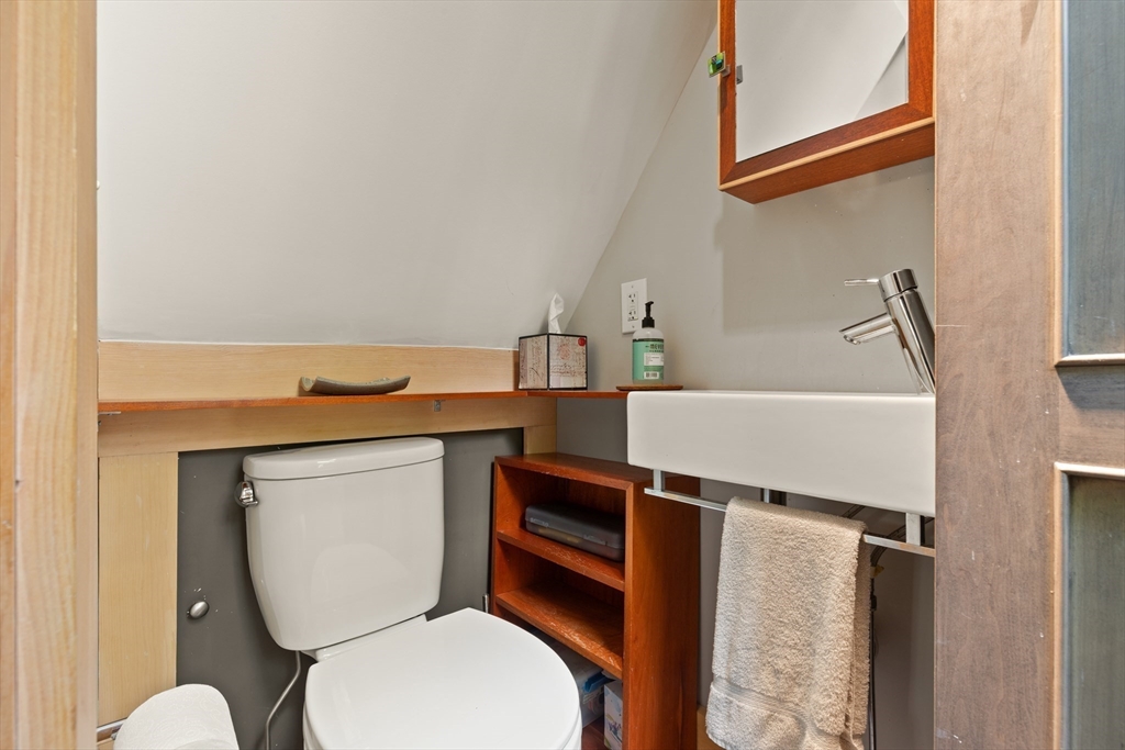 32 Hawthorn Street Cambridge, MA 02138 - Photo 25 of 42 a bathroom with a toilet a sink and a mirror