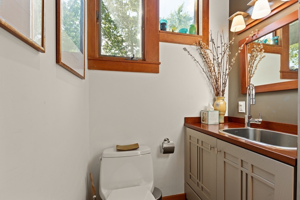 32 Hawthorn Street Cambridge, MA 02138 - Photo 27 of 42 a bathroom with a toilet sink and mirror