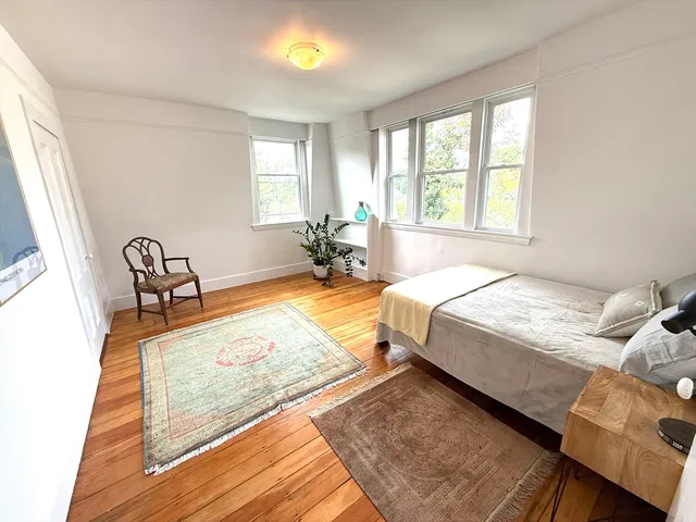 a bedroom with bed and a window