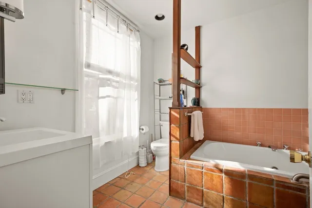 a bathroom with a sink and a shower