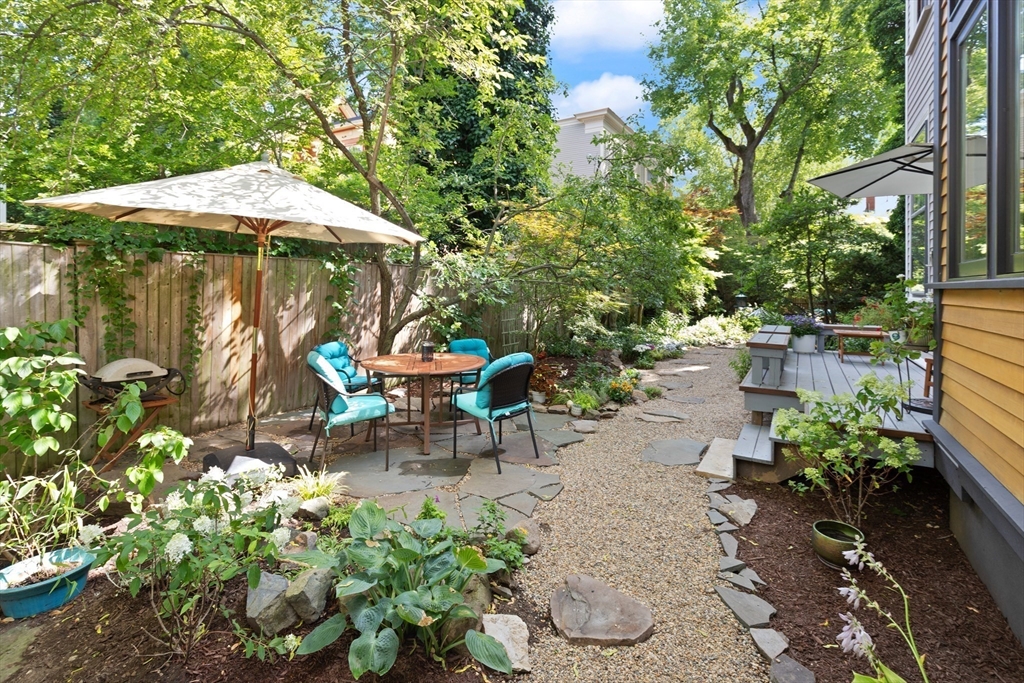 32 Hawthorn Street Cambridge, MA 02138 - Photo 36 of 42 an outdoor space with patio and umbrella