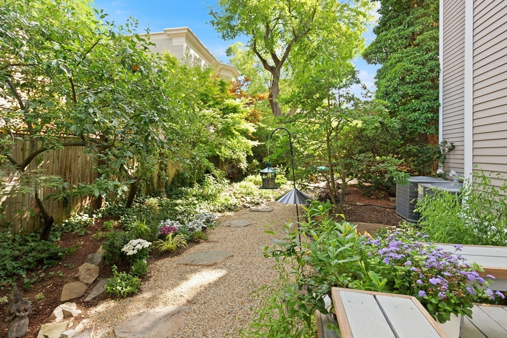 32 Hawthorn Street Cambridge, MA 02138 - Photo 37 of 42 a backyard of a house with a yard and outdoor seating