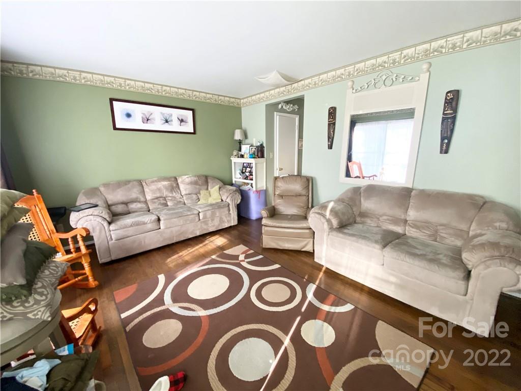 3239 Edsel Place Charlotte, NC 28205 - Photo 1 of 9 a living room with furniture and a couch
