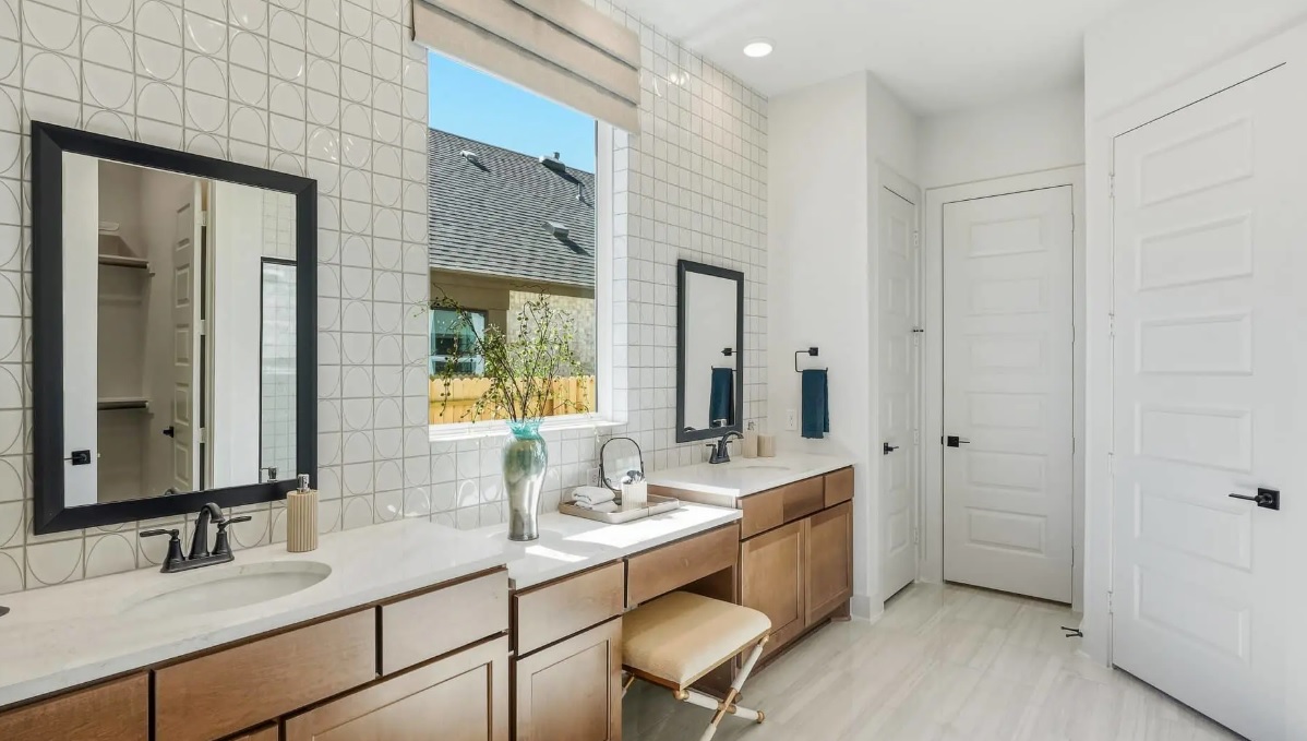 248 Prickly Poppy Way Georgetown, TX 78633 - Photo 8 of 21 A generous double vanity offers ample space for daily routines in this well-appointed bathroom.