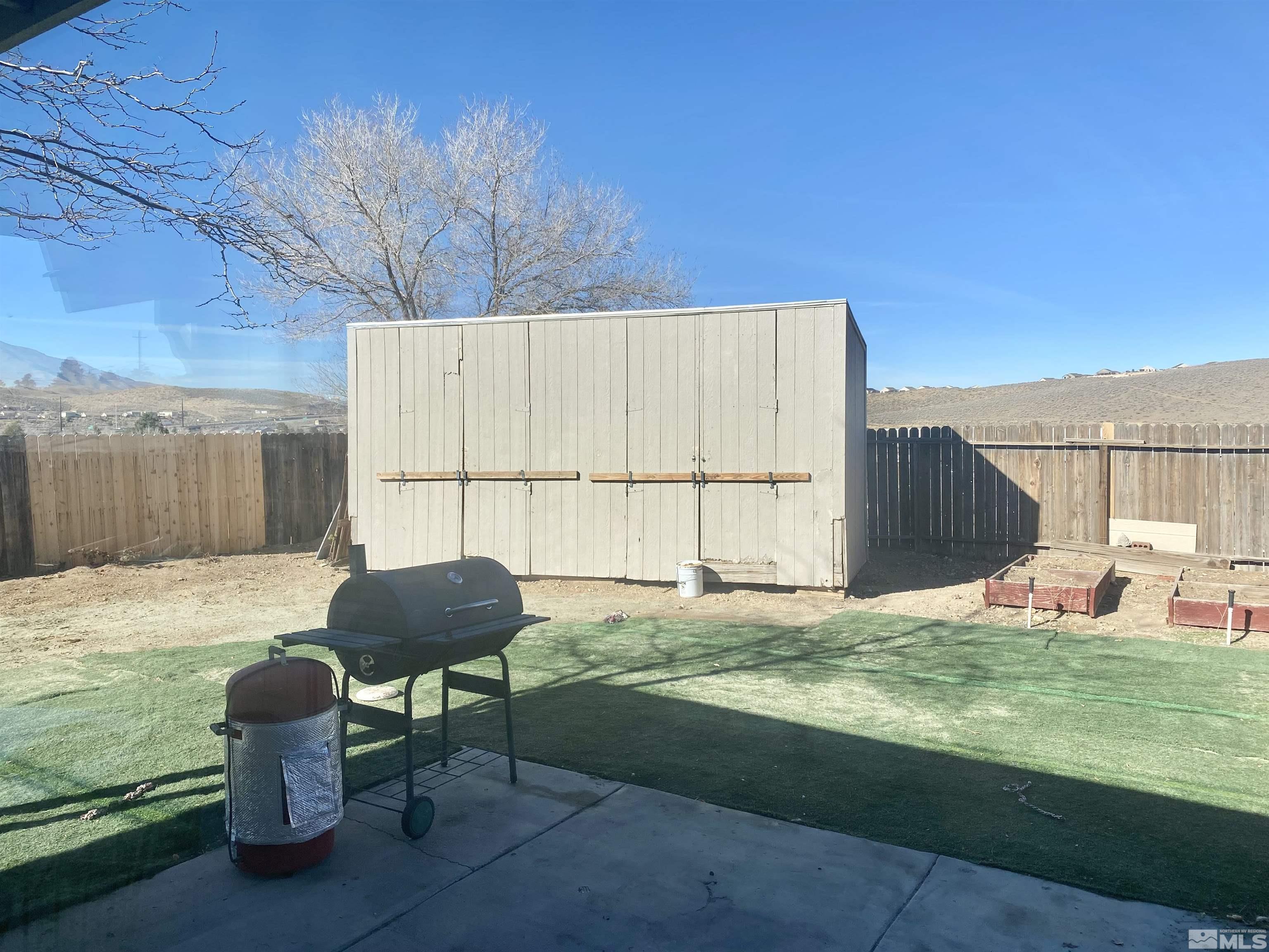 1489 Kate Lane Reno, NV 89506 - Photo 21 of 23 a swimming pool with outdoor seating and yard