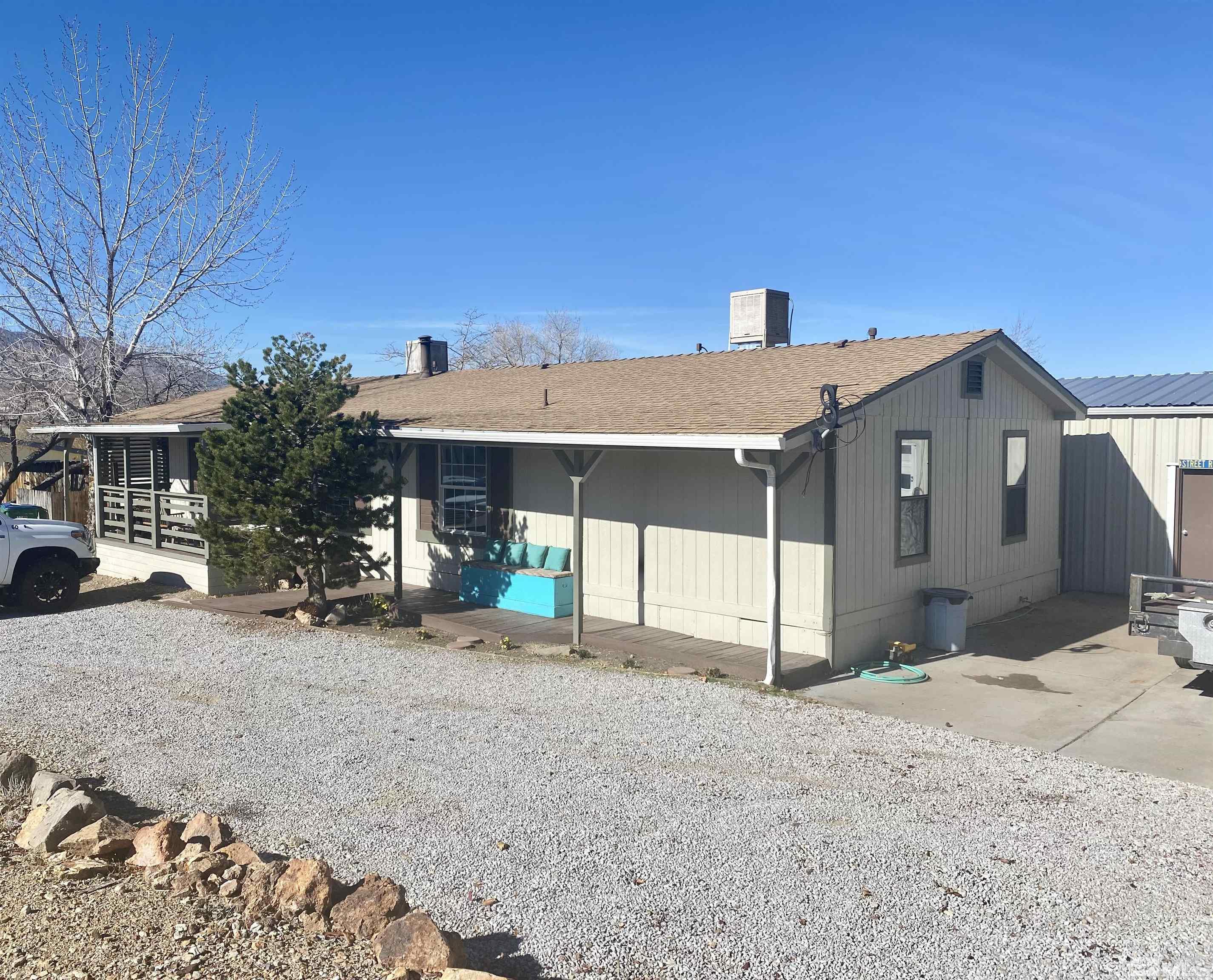 1489 Kate Lane Reno, NV 89506 - Photo 3 of 23 a front view of a house with a yard