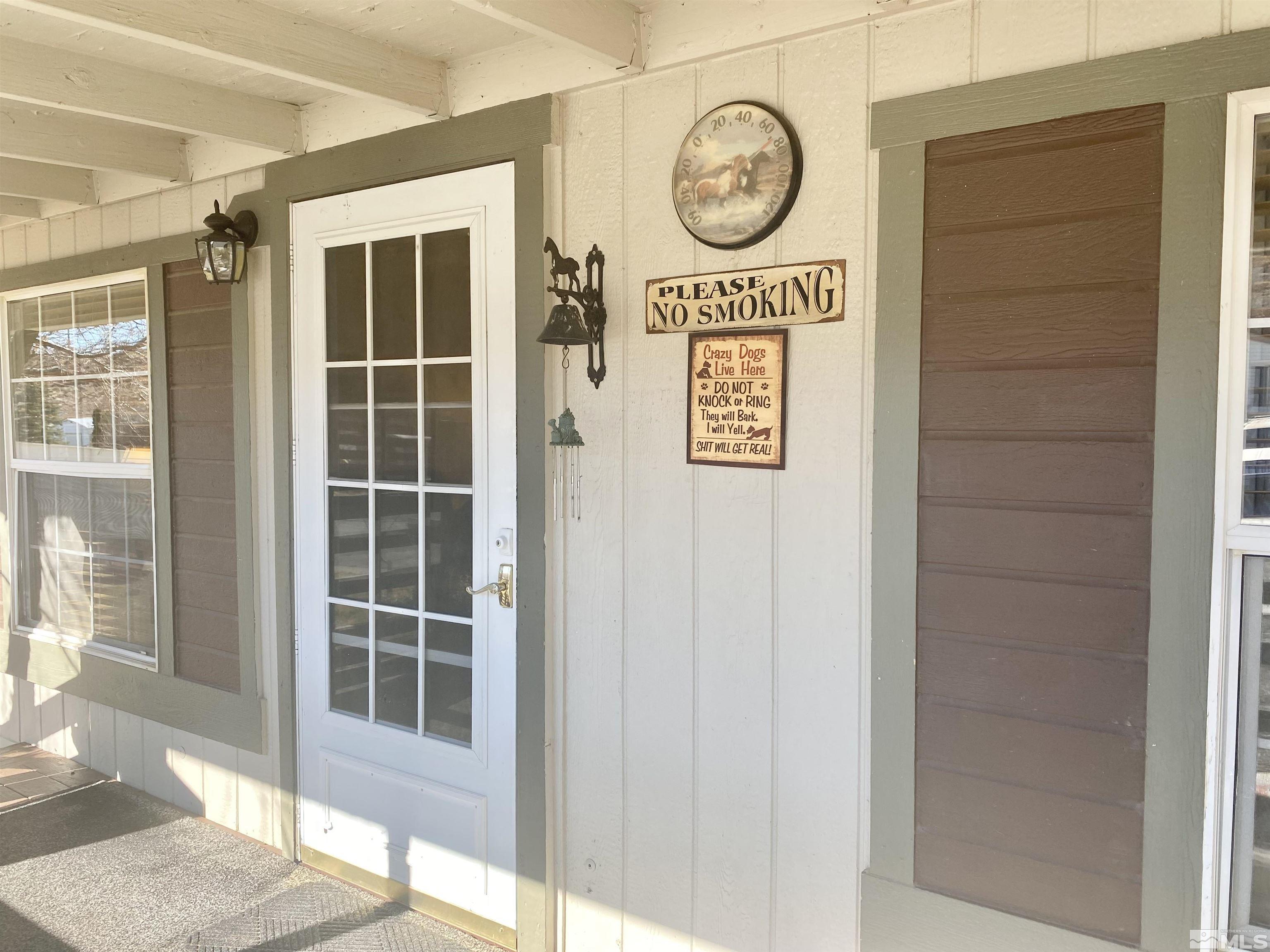 1489 Kate Lane Reno, NV 89506 - Photo 5 of 23 a view of a door with a sign on the wall