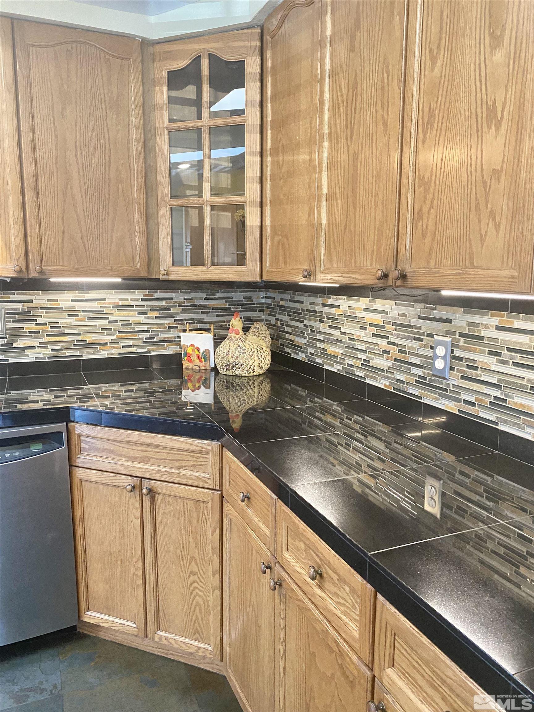 1489 Kate Lane Reno, NV 89506 - Photo 8 of 23 a kitchen with granite countertop cabinets and window