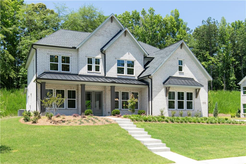 2475 Stewart Road Cumming, GA 30041 - Photo 2 of 30 a front view of house with yard and green space