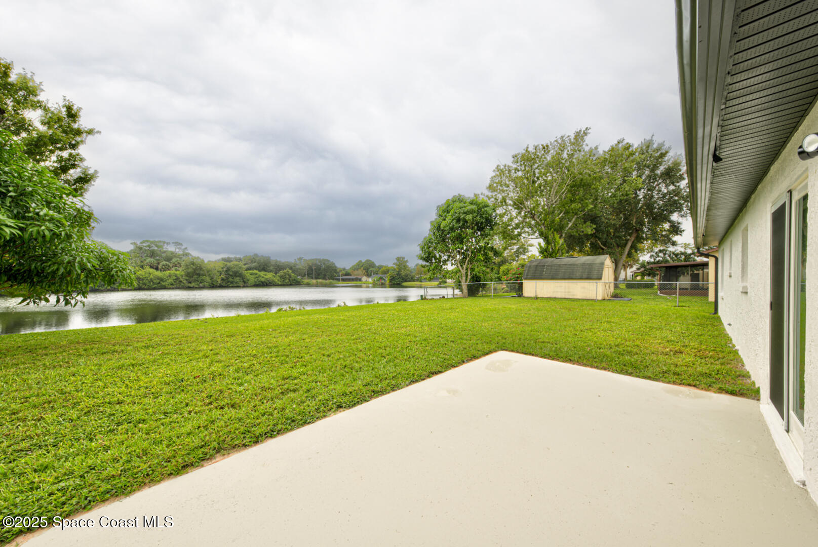 3733 Crossbow Drive Cocoa, FL 32926 - Photo 25 of 25 a view of building with garden and trees