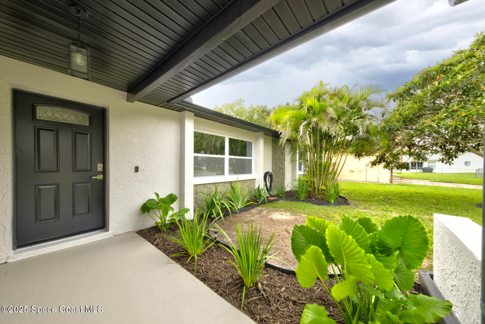 3733 Crossbow Drive Cocoa, FL 32926 - Photo 3 of 25 a front view of a house with garden