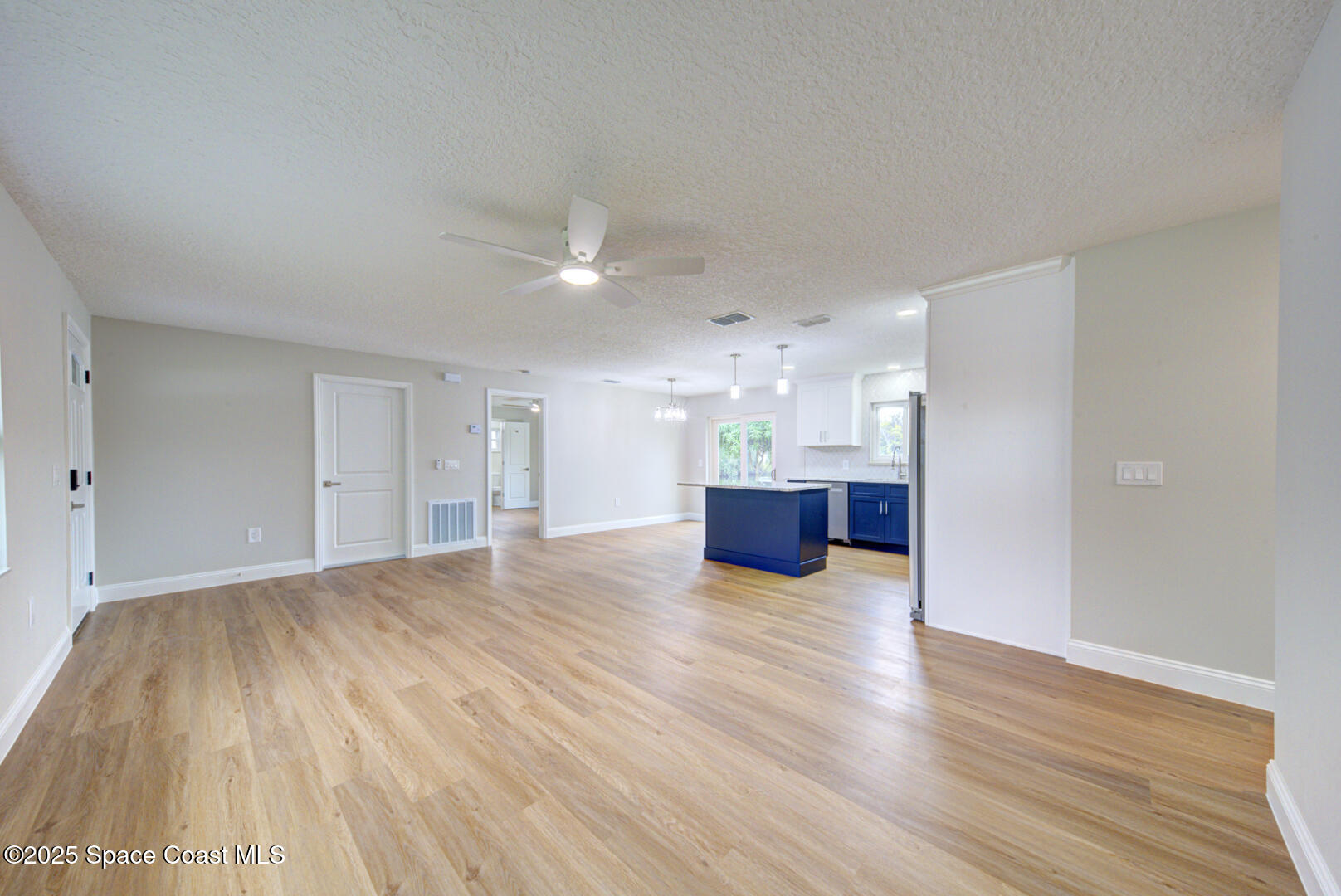 3733 Crossbow Drive Cocoa, FL 32926 - Photo 7 of 25 a view of kitchen and hall with wooden floor