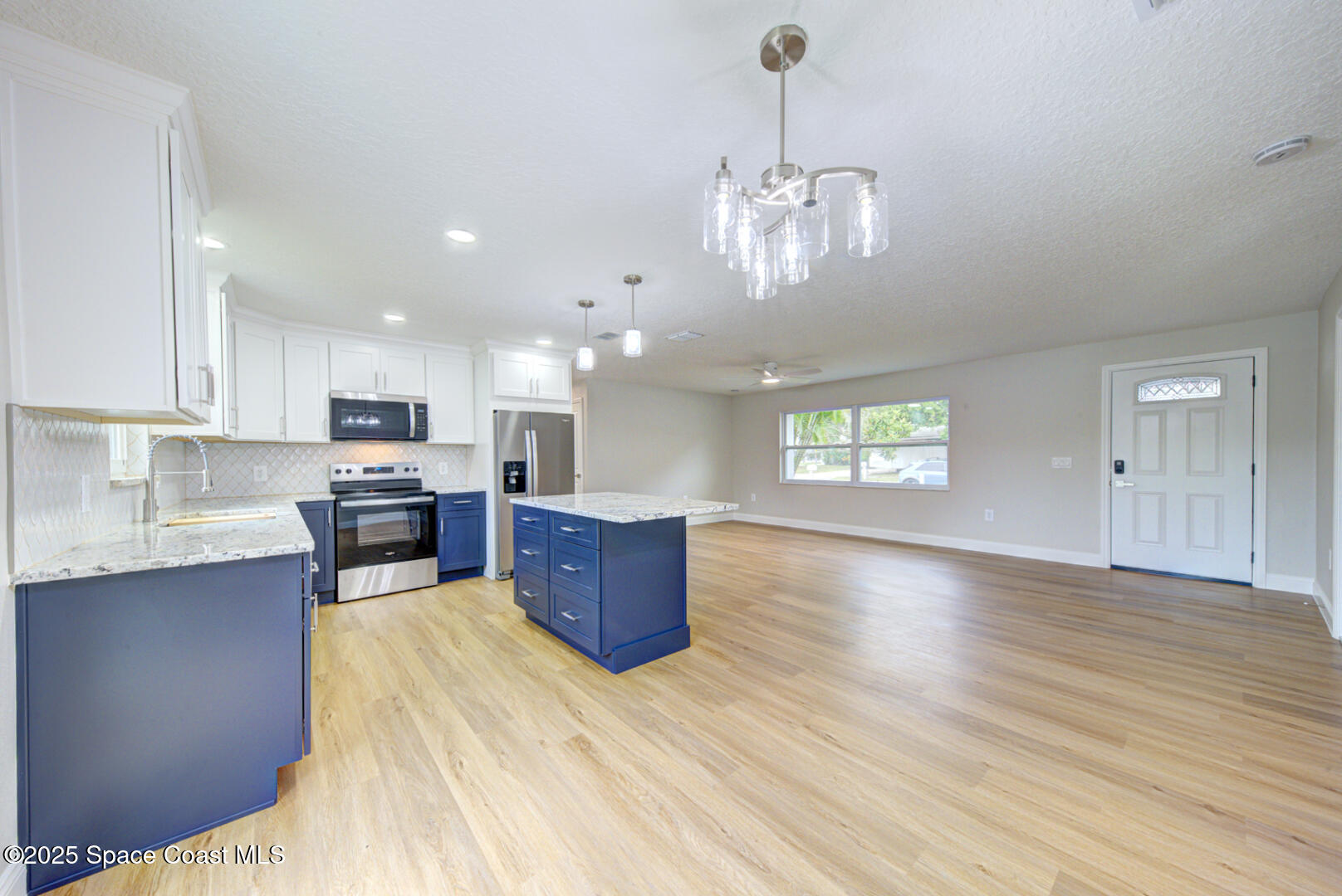 3733 Crossbow Drive Cocoa, FL 32926 - Photo 10 of 25 a view of a kitchen with stove top oven and cabinets