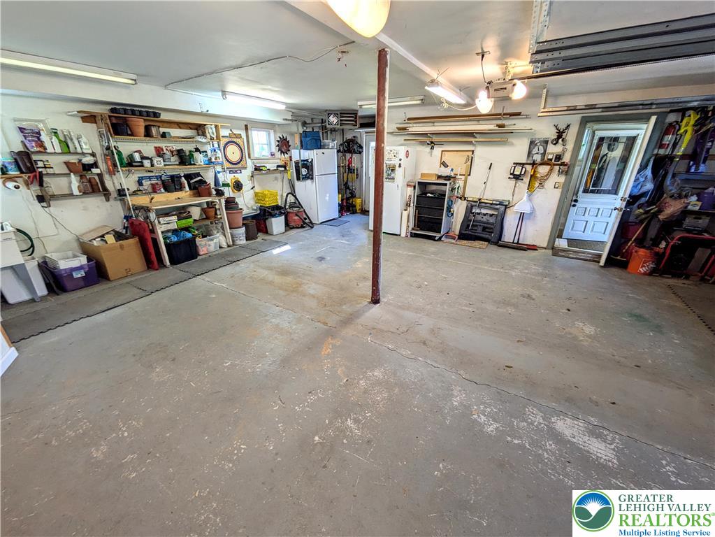 1731 Howell Road Easton, PA 18040 - Photo 32 of 60 A spacious garage features durable concrete flooring and ample room for storage or workshops.