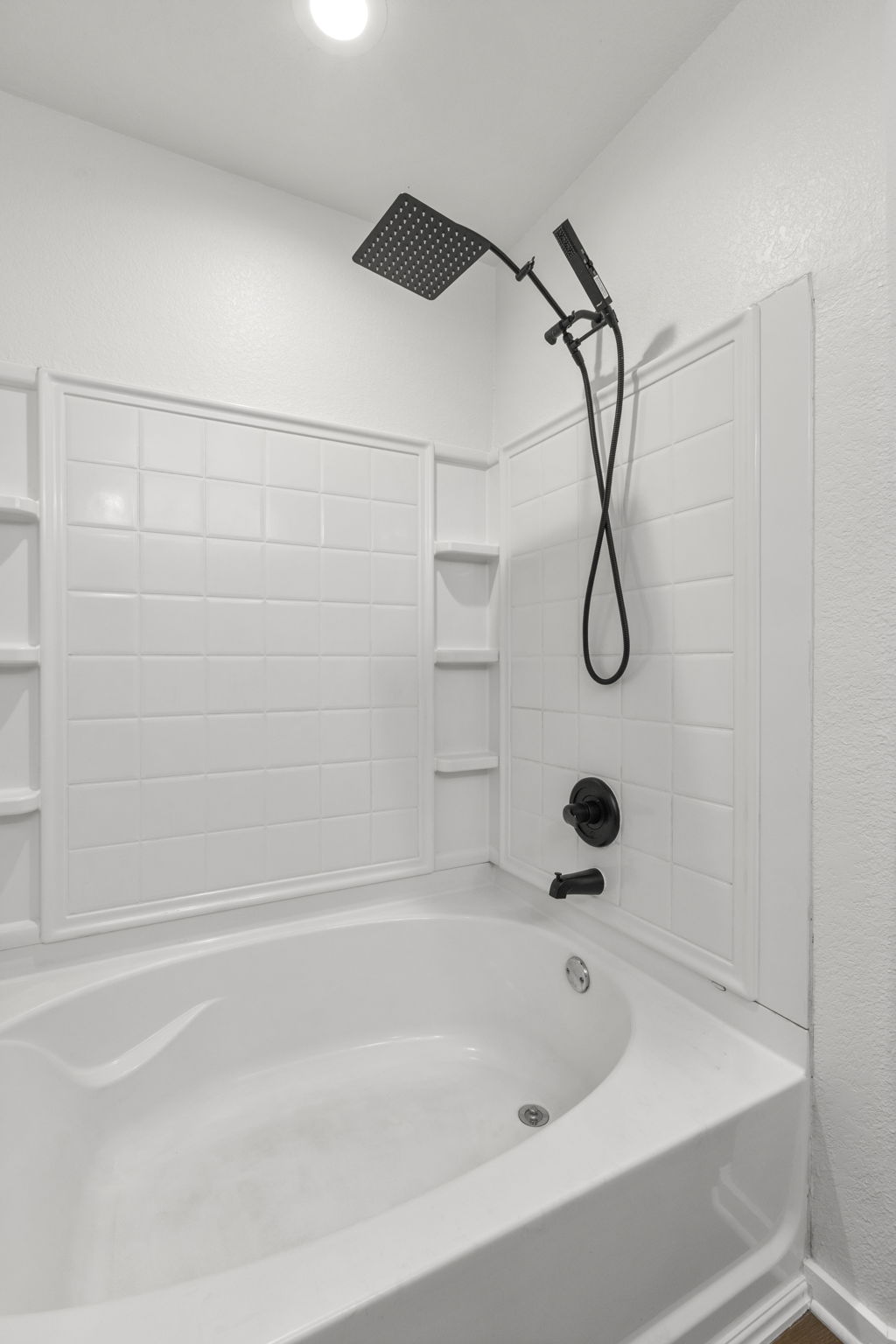 2110 Nogales Trail Austin, TX 78744 - Photo 23 of 37 a bathroom with a bath tub with a shower