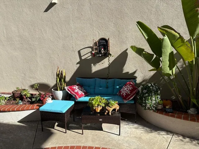 a front view of a house with outdoor seating