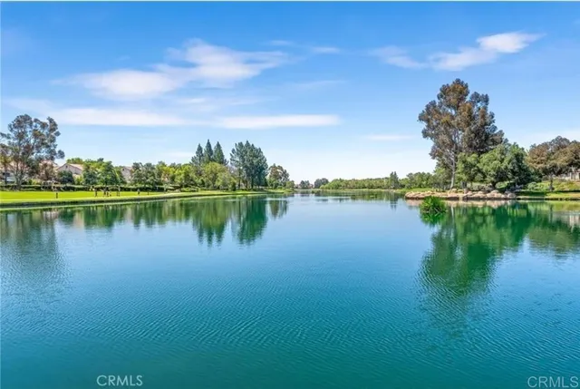 a view of a lake with houses in the back