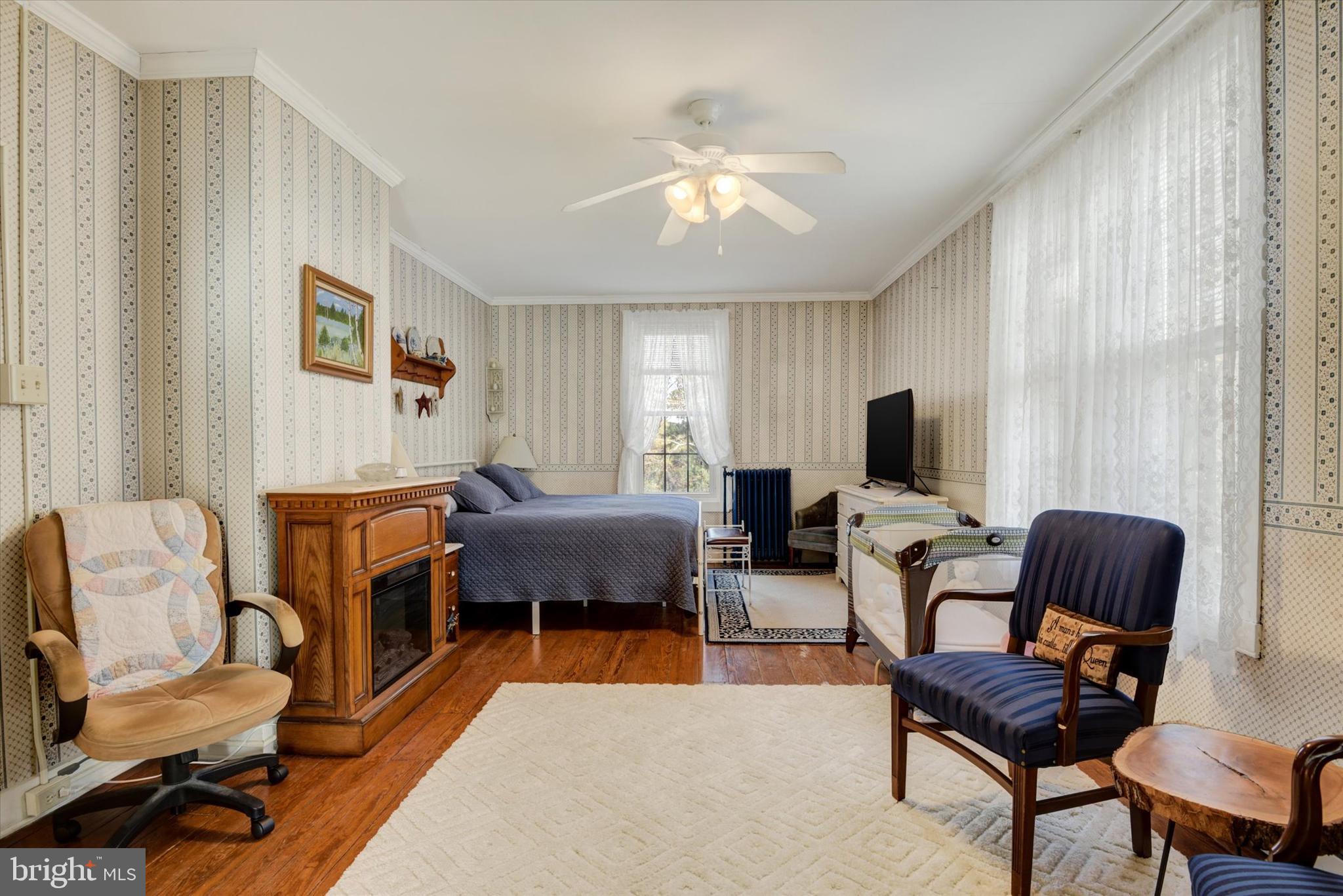 6739 South Clifton Road Frederick, MD 21703 - Photo 25 of 52 Large bedroom with fireplace