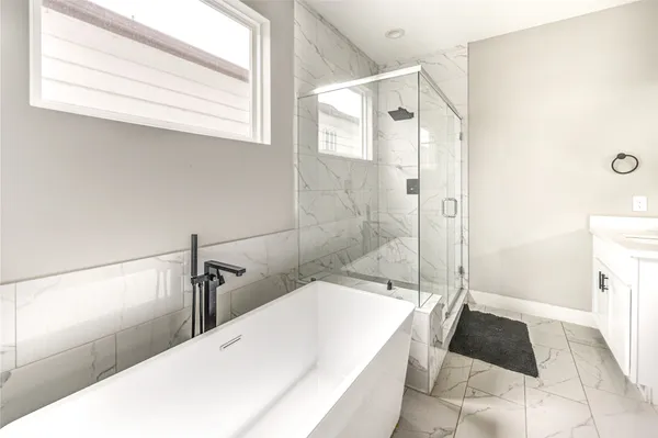 a view of a house with a yard and pathway