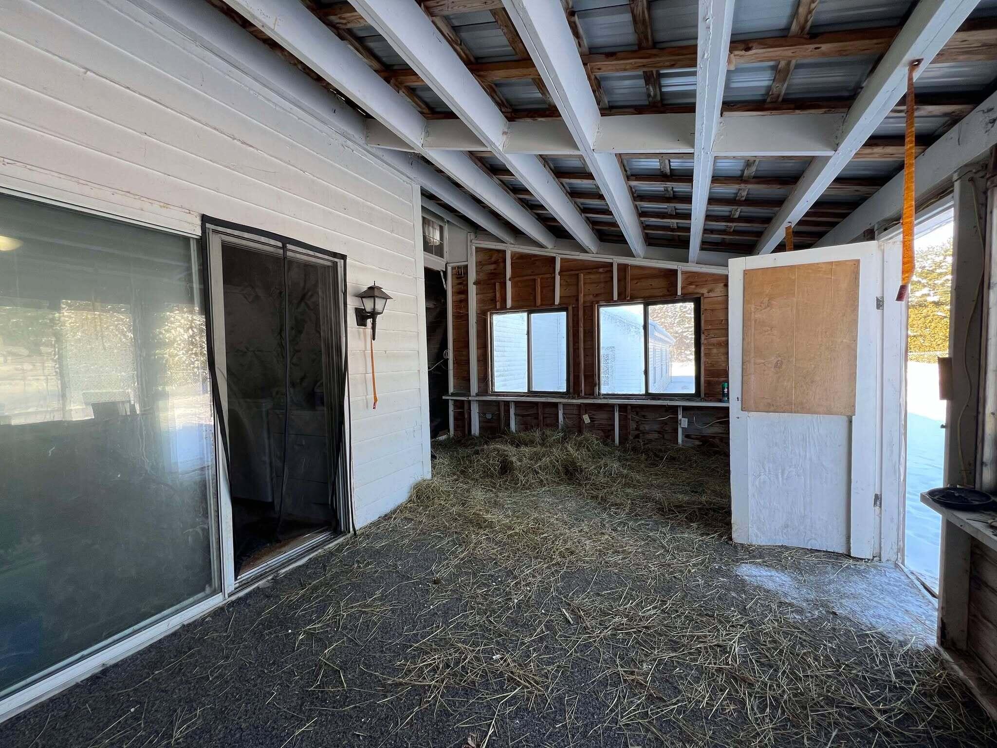 932 Van Buren Road Caswell, ME 04750 - Photo 27 of 49 Covered porch leading to fenced in area