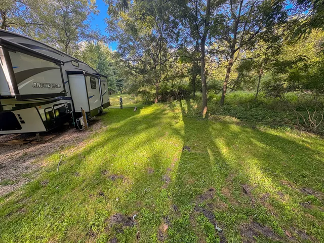 a backyard of a house with lots of green space