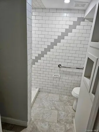 a bathroom with a sink and toilet