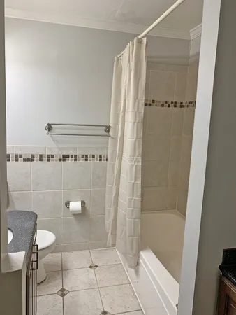 a bathroom with a shower and a toilet