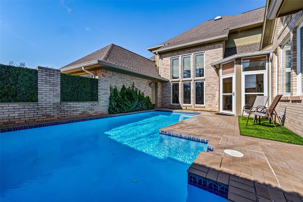 8908 Brierfield Road Granbury, TX 76049 - Photo 31 of 40 a front view of a house with garden