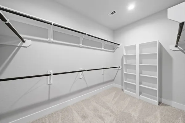 a view of an empty walk in closet