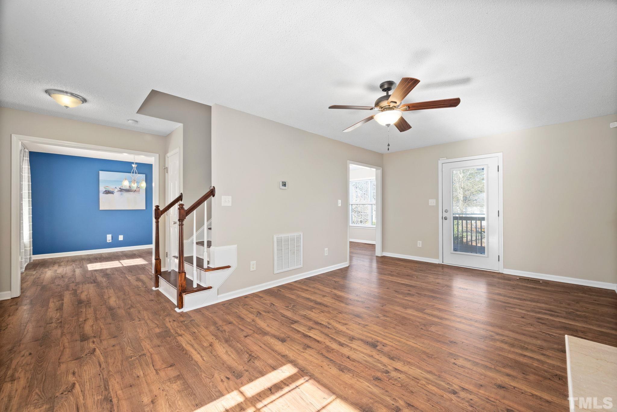 124 Gentle Rio Court Garner, NC 27529 - Photo 11 of 37 a view of a room with gym equipment and windows